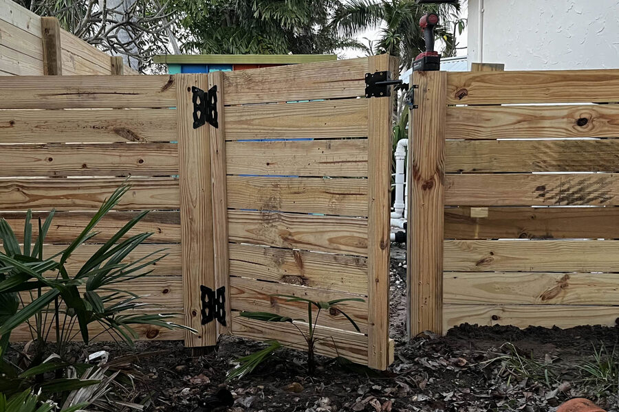 Wood privacy fence installation in progress at a Grand Rapids property