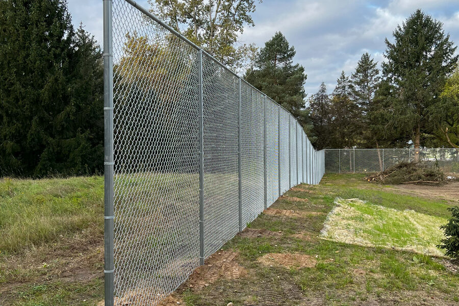 Chain link fence installation at a West Michigan property