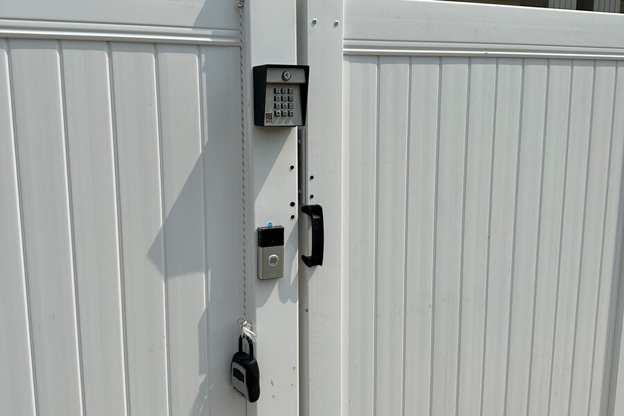 White vinyl privacy fence installation in West Michigan