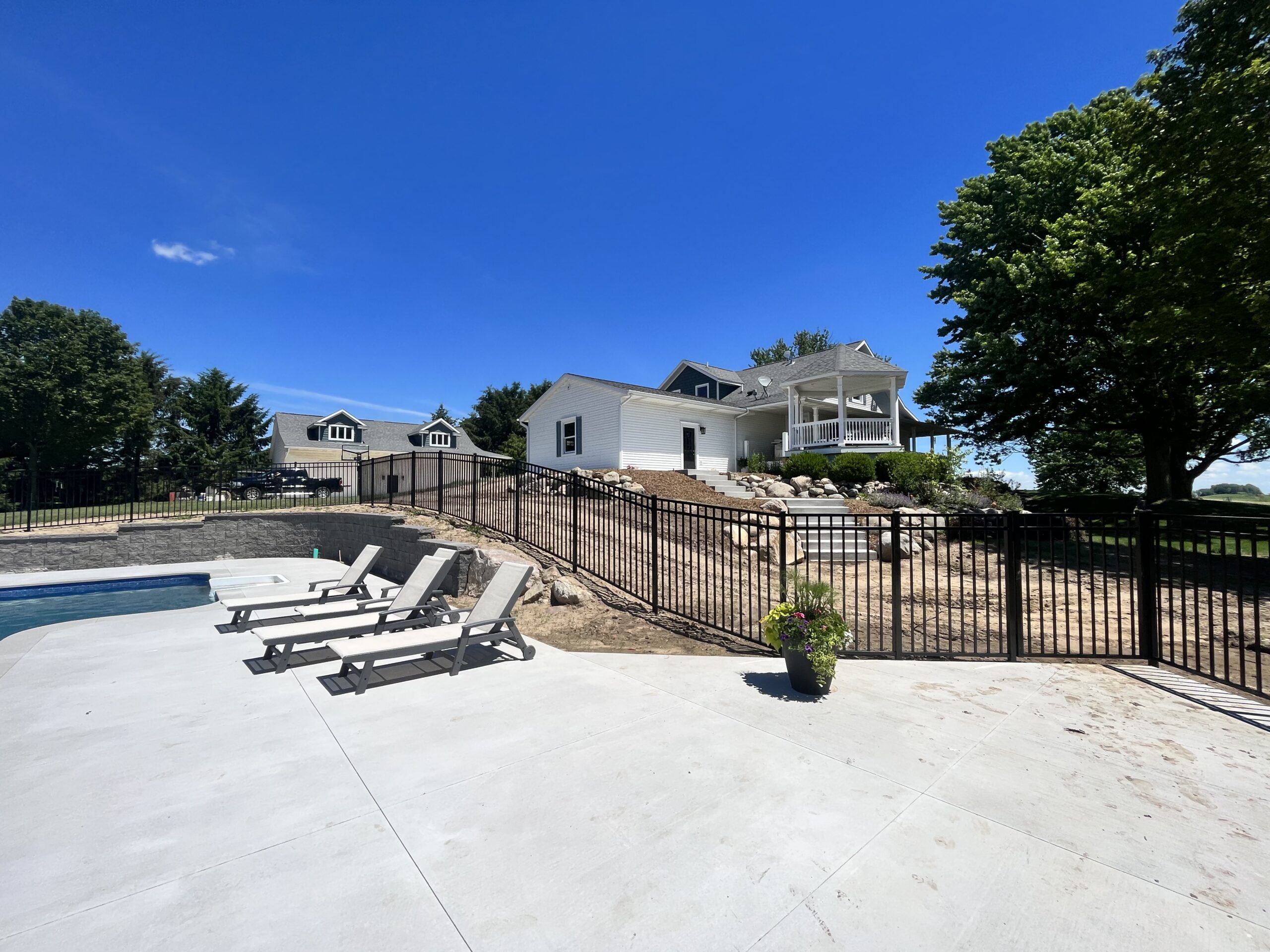 Black aluminum fence around West Michigan pool
