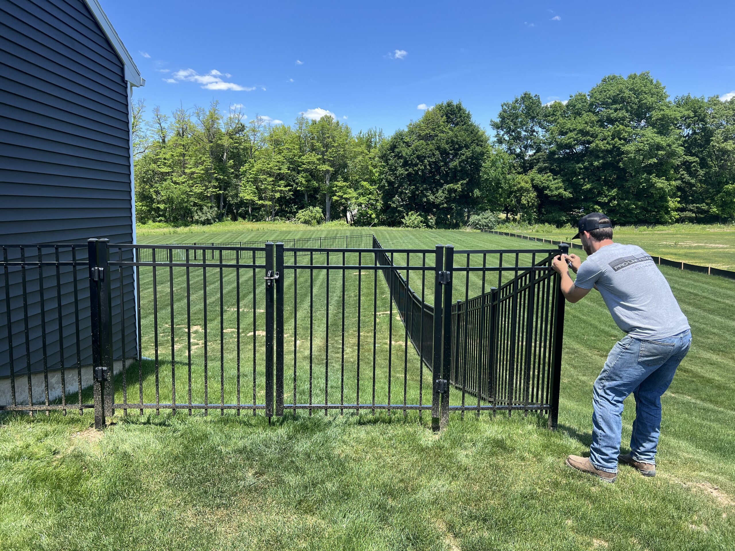 Black aluminum ornamental fence on residential property