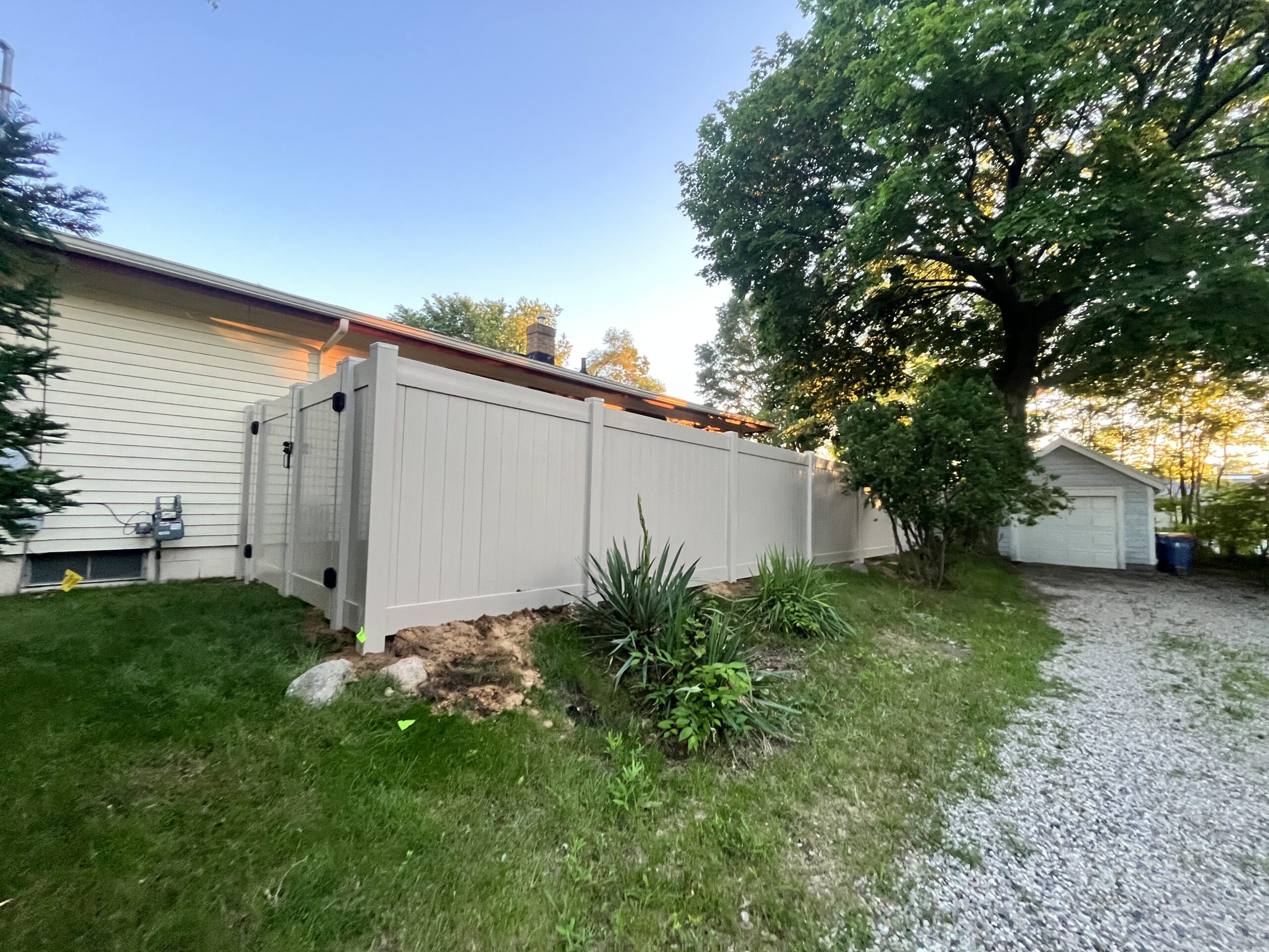Vinyl privacy fence in a Grand Rapids backyard