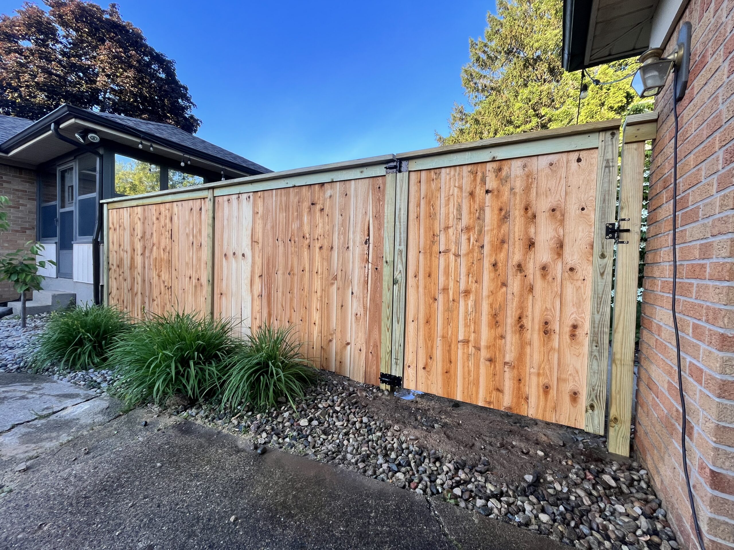 Cedar privacy fence in Grand Rapids backyard
